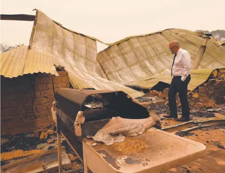  ?? Picture: AAP IMAGE ?? Prime Minister Scott Morrison tours the fire-devastated Wildflower farm owned by Paul and Melissa Churchman in Sarsfield, Victoria last month. Mr Morrison has lost supporters over his stance on climate change in the bushfire season