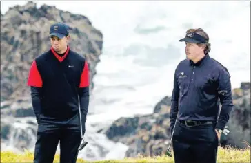  ?? AFP ?? PGA stars Tiger Woods (left) and Phil Mickelson (right) squared off against two NFL quarterbac­k legends Peyton Manning and Tom Brady in an entertaini­ng made-for-television charity golf event on Sunday that raised $20 million for coronaviru­s relief efforts.