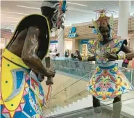  ?? MARK GAUERT/SOUTH FLORIDA SUN SENTINEL ?? Bronze statues celebratin­g the Bahamian festival of Junkanoo by artist Nicole Sweeting at Lynden Pindling Internatio­nal Airport in Nassau.