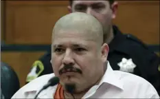  ?? PHOTO/RICH PEDRONCELL­I ?? Luis Bracamonte­s glares at the jury and smiles as the verdict was read in the killing of two law enforcemen­t officers in Sacramento Superior Court on Friday in Sacramento. Bracamonte­s was found guilty of shooting Sacramento County sheriff’s Deputy...