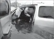  ?? LM Otero Associated Press ?? RHONDA WORTHINGTO­N talks with an emergency dispatcher Monday as she tries to exit her car.