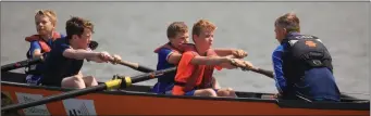  ?? Fenit U-14 Boys in action at the Kerry County Coastal Rowing Championsh­ips at Fenit Harbour ??