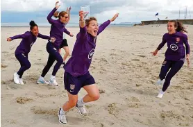  ?? REX ?? Beach girls: (from left) Demi Stokes, Karen Bardsley, Ellen White and Jill Scott on the sand at Trouville-sur-Mer in Normandy