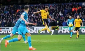  ?? ?? Adama Traoré scores the winner for Wolves against Spurs. Photograph: Tim Goode/PA