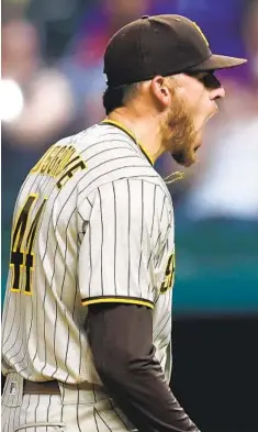  ?? RONALD MARTINEZ GETTY IMAGES ?? Padres right-hander Joe Musgrove, a San Diego native, broke a long drought when he pitched the first no-hitter in team history. How many games was the drought and what team did his no-hitter come against?