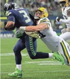  ?? ASSOCIATED PRESS ?? Packers linebacker Kyler Fackrell runs down Seahawks quarterbac­k Russell Wilson. Fackrell recorded three sacks Thursday night.