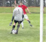  ??  ?? Gary Sutherland nutmegs the Kennoway keeper then slams in his third goal but it wasn’t enough as Tayport lost 4-3.