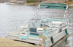  ?? Keith Bryant/The Weekly Vista ?? This pontoon boat, tethered near the Lake Ann boat launch, has been severely damaged by vultures who have torn up the seats, Bella Vista police officer Terry Dickey said.