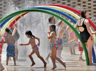  ?? DIGITAL FIRST MEDIA FILE PHOTO ?? Children and adults enjoyed the first day of summer cooling off in the Pottstown Spray Park.
