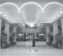  ?? WONG MAYE-E, AP ?? A staff member of the newly renovated Koryo hotel walks across its main lobby in Pyongyang, North Korea.