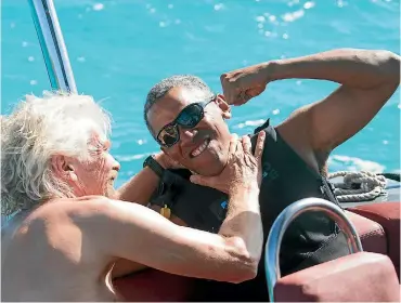  ?? PHOTO: REUTERS ?? Former US President Barack Obama and British businessma­n Sir Richard Branson sit on a boat during Obama’s holiday on Branson’s Moskito island, in the British Virgin Islands.