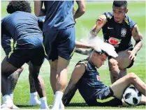  ??  ?? FLOUR POWER Barcelona‘s midfield schemer Philippe Coutinho was doused with eggs and flour by his Brazil team-mates to mark his 26th birthday during training this week