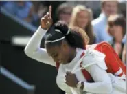  ?? KIRSTY WIGGLESWOR­TH — THE ASSOCIATED PRESS ?? Serena Williams celebrates winning her women’s singles quarterfin­als match against Camila Giorgi at Wimbledon in London, Tuesday.