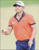  ?? Michael Reaves / Getty Images ?? Kurt Kitayama waves on the 18th green during the third round of the Arnold Palmer Invitation­al on Saturday in Orlando, Florida.