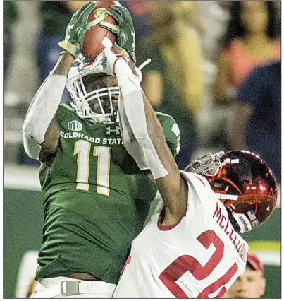  ?? NWA Democrat-Gazette/BEN GOFF ?? Colorado State wide receiver Preston Williams (11) makes a catch in front of Arkansas cornerback Jarques McClellion in the fourth quarter Saturday night in Fort Collins, Colo. Williams had 12 catches for 154 yards and 2 touchdowns, and the Rams outscored the Razorbacks 17-0 in the fourth quarter to take the victory.