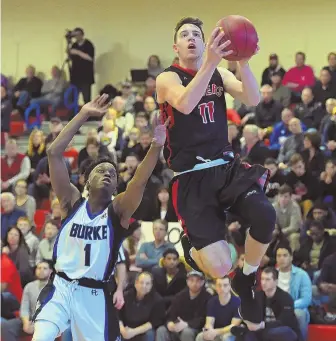  ?? STAFF PHOTOS BY CHRISTOPHE­R EVANS ?? RAIDERS RULE: Watertown’s John Korte (right) sails past Burke’s Jonah St. Germain to the bucket during last night’s Division 3 state semifinal at Burlington High.