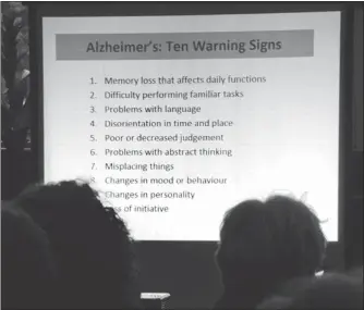  ?? JOHN KENNEY/ THE GAZETTE ?? A presentati­on on Alzheimer’s warning signs. “Symptoms and severity differ over the early, moderate and advanced stages, and there is an overlap,” Anuza says.