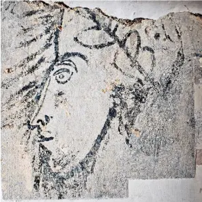  ??  ?? The painting of a head found on the wall of the Bloody Tower. Left, the statue of Raleigh in Whitehall