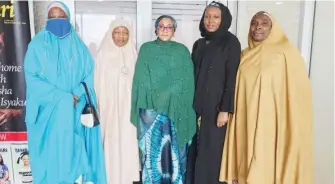  ?? PHOTO: Jamilu Adamu ?? Members and Team Lead, Nigerian Coalition of Muslim Women, Zulai Nuhu (Second right), Deputy Weekend Editor, Daily Trust, Amina Alhassan during the Coalition’s visit to Media Trust yesterday to mark the World Hijab Day.