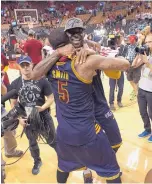  ?? FRANK GUNN/THE CANADIAN PRESS VIA AP ?? Cleveland’s LeBron James celebrates with teammate J.R. Smith (5) after the Cavaliers beat Toronto to advance to the NBA Finals.