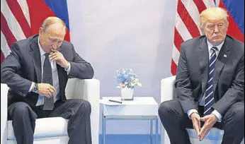  ?? AFP FILE ?? US President Donald Trump and Russia's President Vladimir Putin at the G20 Summit on July 7.