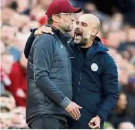  ??  ?? That was fun: Manchester City manager Pep Guardiola (right) talking to his Liverpool counterpar­t Juergen Klopp after their Premier League match at Anfield on Sunday.