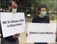  ?? ANI ?? Baloch political and human rights activists hold placards as they protest against Pakistan and China over human rights violations in Balochista­n, in Toronto on Sunday.