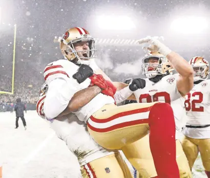  ?? JEFF HANISCH/USA TODAY SPORTS ?? Robbie Gould celebrates with teammates after kicking the winning field goal for the 49ers to end the NFC divisional playoff game against the Packers.