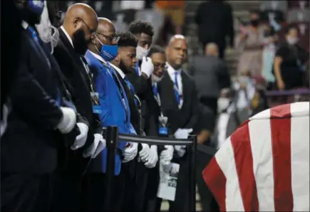  ?? BRYNN ANDERSON — THE ASSOCIATED PRESS ?? Fraternity members sing in front of the casket of the late Rep. John Lewis, D- Ga., during a service celebratin­g “The Boy From Troy” at Troy University on Saturday in Troy, Ala. Lewis died July 17at the age of 80.