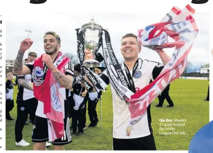  ??  ?? On fire Moore’s 27 goals helped Ayr to the League One title