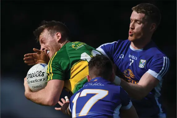  ?? Photo by Sportsfile ?? Donnchadh Walsh gets some close attention from Cavan’s Niall Murray, 17, and Rory Dunne during the Allianz Football League Division 1 Round 6 match at Breffni Park in, Cavan last Sunday