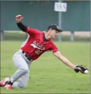  ?? Tim Conover ?? Caden Holm of Broken Bow makes a great effort in center field during their doublehead­er against Sutton Sunday but came up just short of the catch as the ball hit the end of his glove.