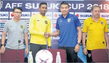  ??  ?? FROM LEFT Malaysia coach Tan Cheng Hoe and midfielder Syamer Kutty Abba and Thailand goalkeeper Chatchai Budprom and coach Milovan Rejavac during yesterday’s press conference.