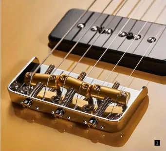  ??  ?? 1. Fender fits its own compensate­d brass bridge saddles to the Noventa Tele. Note the glass-like finish and cool P-90 style soapbar