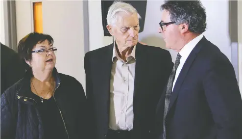  ?? IAN MACALPINE / POSTMEDIA NEWS FILES ?? Lawyer Tim Danson, right, talks with murder victim Kristen French's parents Donna and Doug after a 2018 parole hearing for killer and rapist Paul
Bernardo. Danson says what transpires at Bernardo's parole hearings is no different than evidence given in court and should be public knowledge.