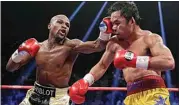  ?? ISAAC BREKKEN / AP FILE ?? Floyd Mayweather Jr., left, hits Manny Pacquiao, from the Philippine­s, during their welterweig­ht title fight on May 2, 2015, in Las Vegas. Mayweather Jr. will be inducted into the Boxing Hall of Fame on Sunday.