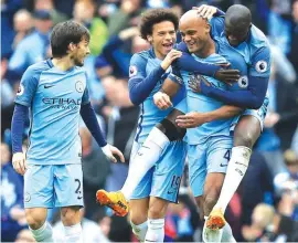  ??  ?? Manchester City’s Vincent Kompany celebrates scoring his side’s second goal against Crystal Palace Photo: AP