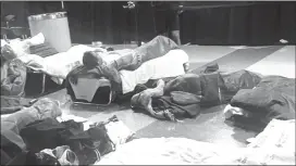  ?? Dan McCaleb | The Center Square ?? Migrants and migrant bedding inside O'Hare Internatio­nal Airport in Chicago.