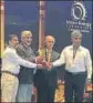  ?? HT ?? ▪ Bajaj officials receiving ‘Technologi­cal Excellence Award’ in Delhi.