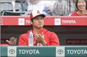  ?? AP PHOTO/RYAN SUN ?? Los Angeles Angels’ Shohei Ohtani watches from the dugout during the third inning of a baseball game against the Detroit Tigers, Sunday, Sept. 17, 2023, in Anaheim, Calif.