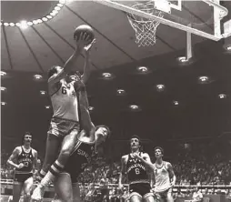  ?? (Ya’akov Sa’ar/GPO) ?? TAL BRODY (with ball) drives to the hoop for a layup during a Maccabi Tel Aviv game against Italian team Bologna at Tel Aviv’s Yad Eliyahu Arena during the yellow-andblue’s 1977 Euroleague championsh­ip-winning campaign.