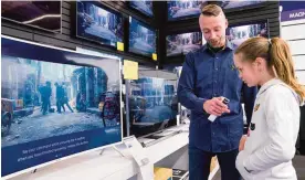  ?? —AP ?? REYKJAVIK: In this photo taken on April 15, 2017, Salome Sigurjonsd­ottir, 10, tests a voice-controlled television in an electronic­s store in Reykjavik.