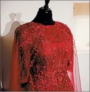  ??  ?? The exhibit on the Queen of Soul features a replica of the red dress Franklin was wearing for her visitation.