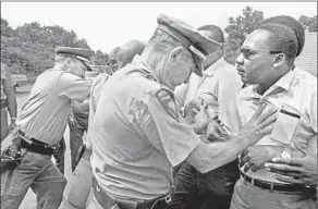  ?? Underwood Archives / Image Works / HBO ?? THE REV. MARTIN Luther King Jr., right, is shoved by Mississipp­i police in June 1966.