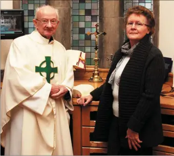  ??  ?? Retiring priest, Fr. Eoin Mangan and Joan Walsh in the sacristy of the Church of Saints Stephen and John in Castleisla­nd. Photo by John Reidy