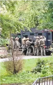  ??  ?? Baltimore County and other jurisdicti­ons deployed armored police vehicles and a helicopter in an unsuccessf­ul attempt to remove a group of people from a Falls Road mansion.