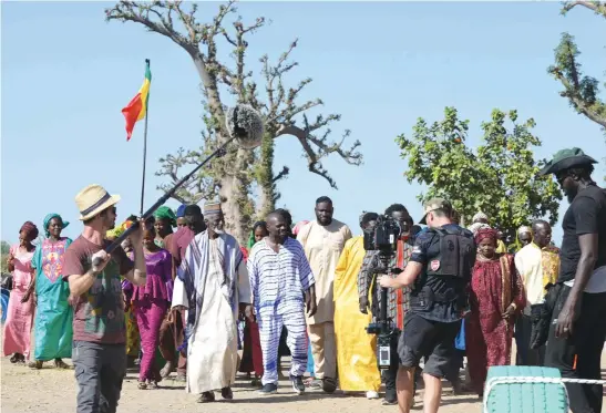  ?? Pictures: AFP ?? SOUND, CAMERA, ACTION. Filming on the set of Banlieusar­d 2 in a forest in Senegal last year. Banlieusar­d 2 is scheduled for release on Netflix this year.