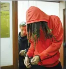  ?? ALEXANDER ZEMLIANICH­ENKO — ASSOCIATED PRESS ?? WNBA star and two-time Olympic gold medalist Brittney Griner leaves a courtroom after a hearing in Khimki, Russia on Friday.