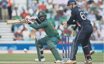  ?? ?? Tamim Iqbal flicks the ball away in his impressive 128 for Bangladesh.