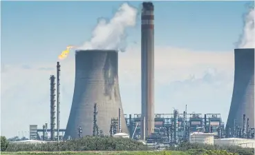  ?? /Bloomberg ?? Dirty habits: Sasol does not dispute that Secunda in Mpumalanga is the world’s biggest single-site emitter, at 56.5-million tonnes of greenhouse gases a year, which exceed the individual totals of more than 100 countries, including Norway and Portugal.